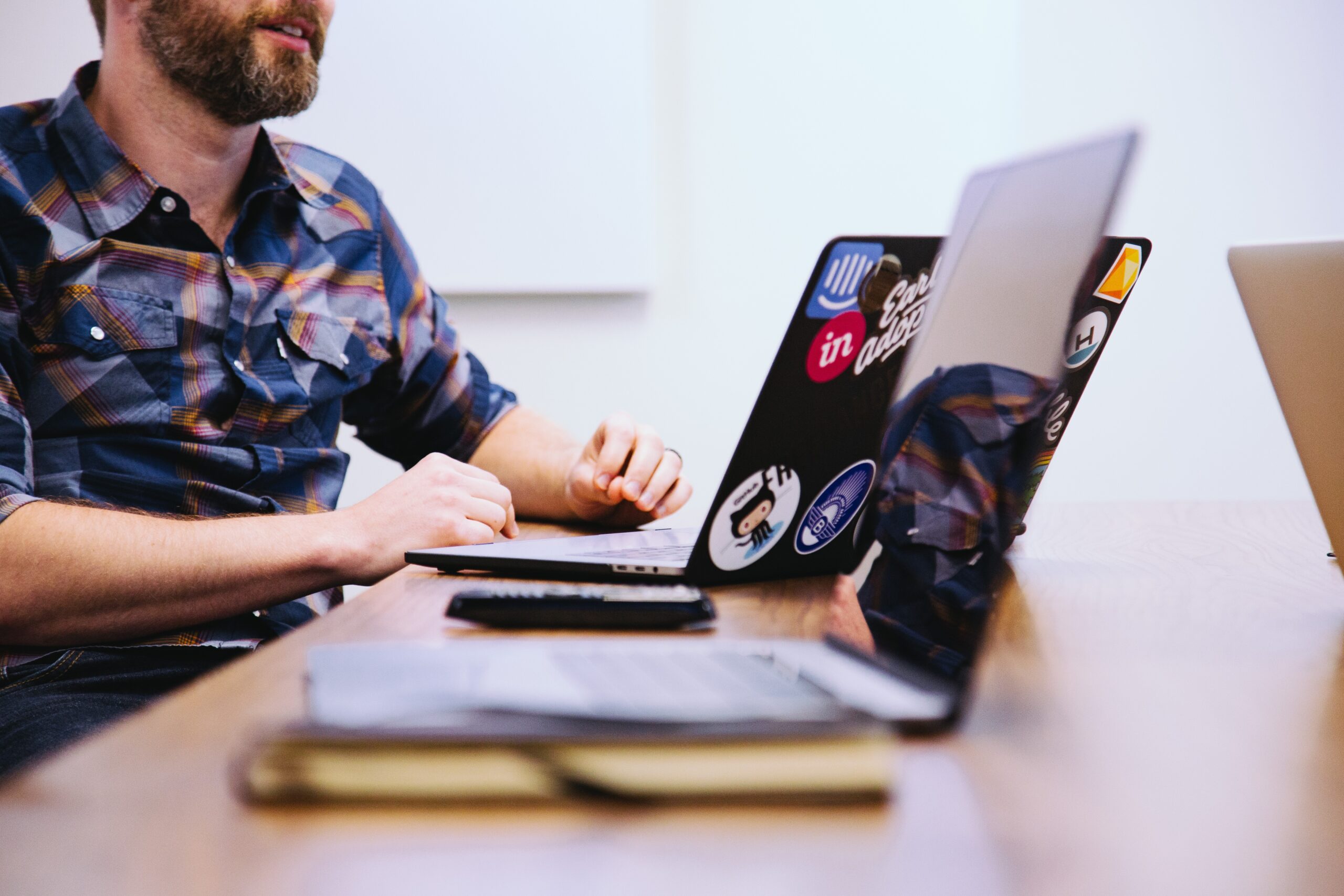 a man using his computer to find ways on how to stop job hopping habits