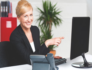 Businesswoman Pointing At Computer