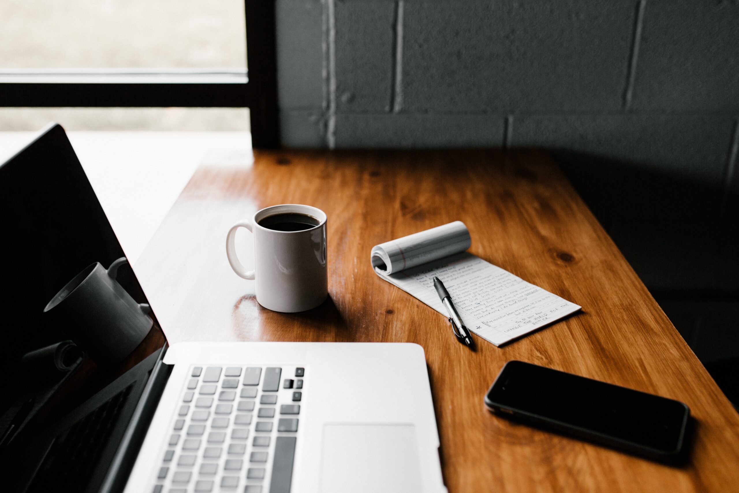 cover letter writing in laptop on top of a table