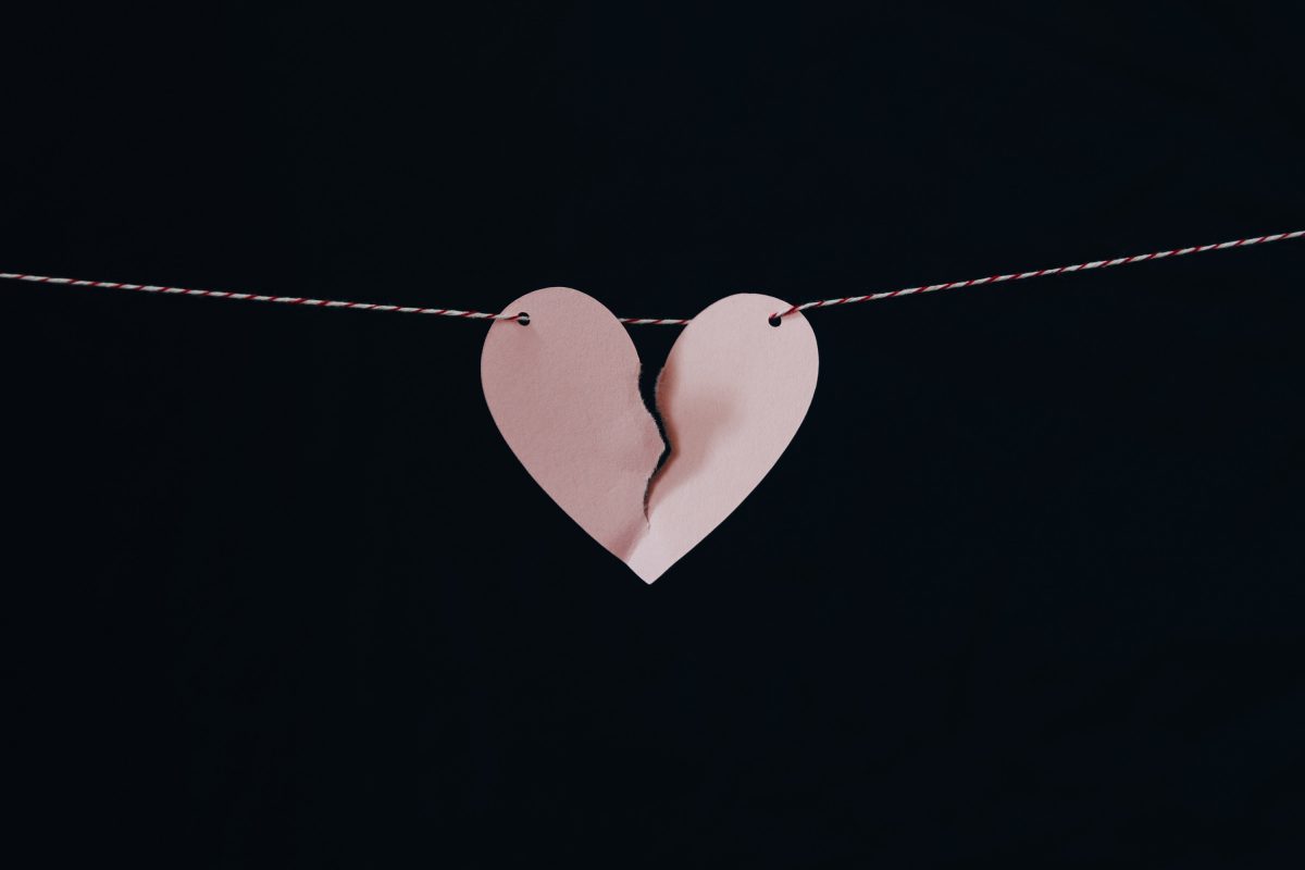 ripped heart in a string representing office breakup