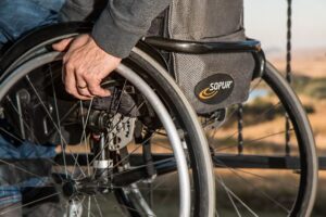 Person with disability sitting on a wheelchair