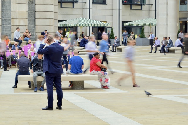 A man in the middle of the city suffering from job search rejection