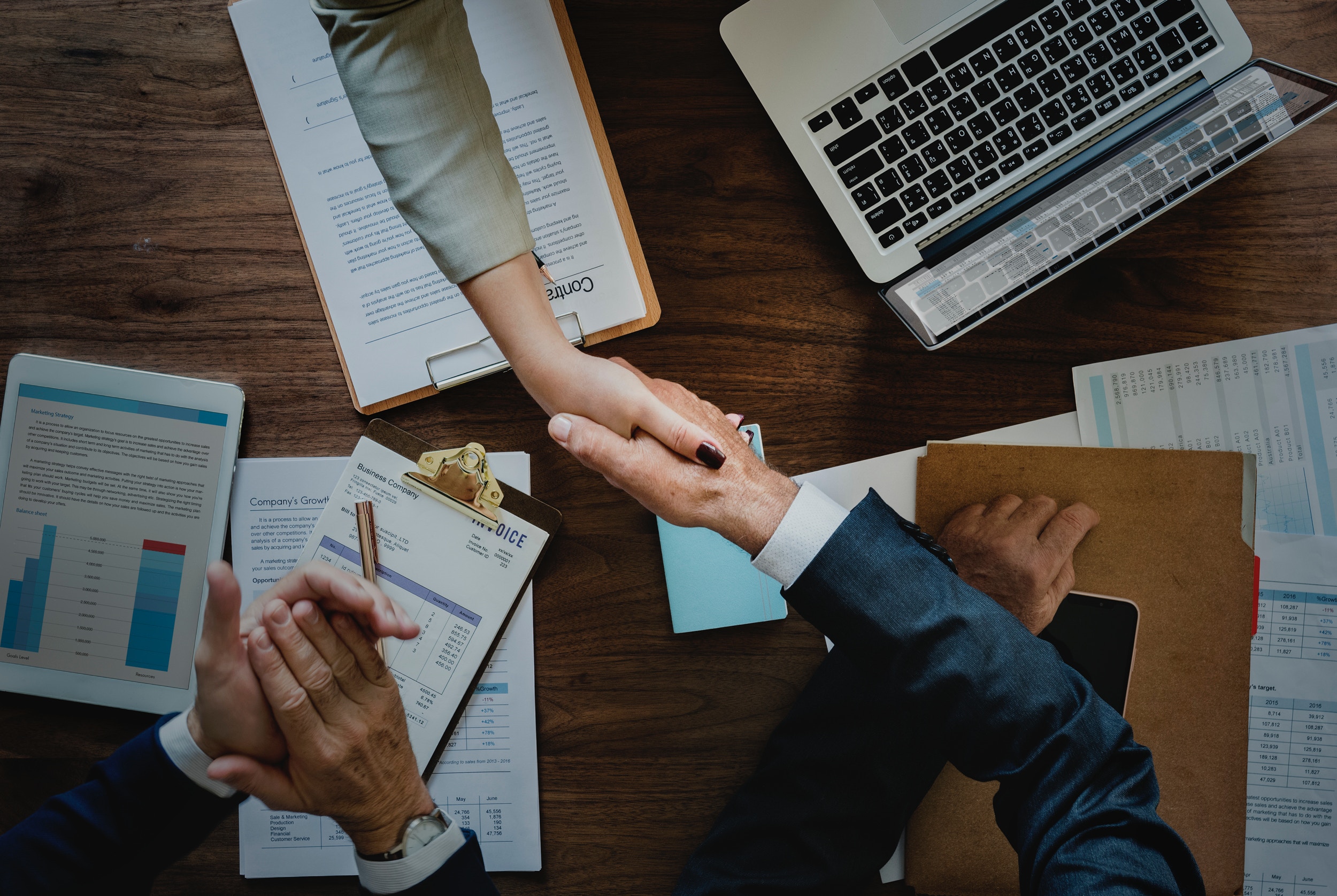 shaking hands after an executive job interview session