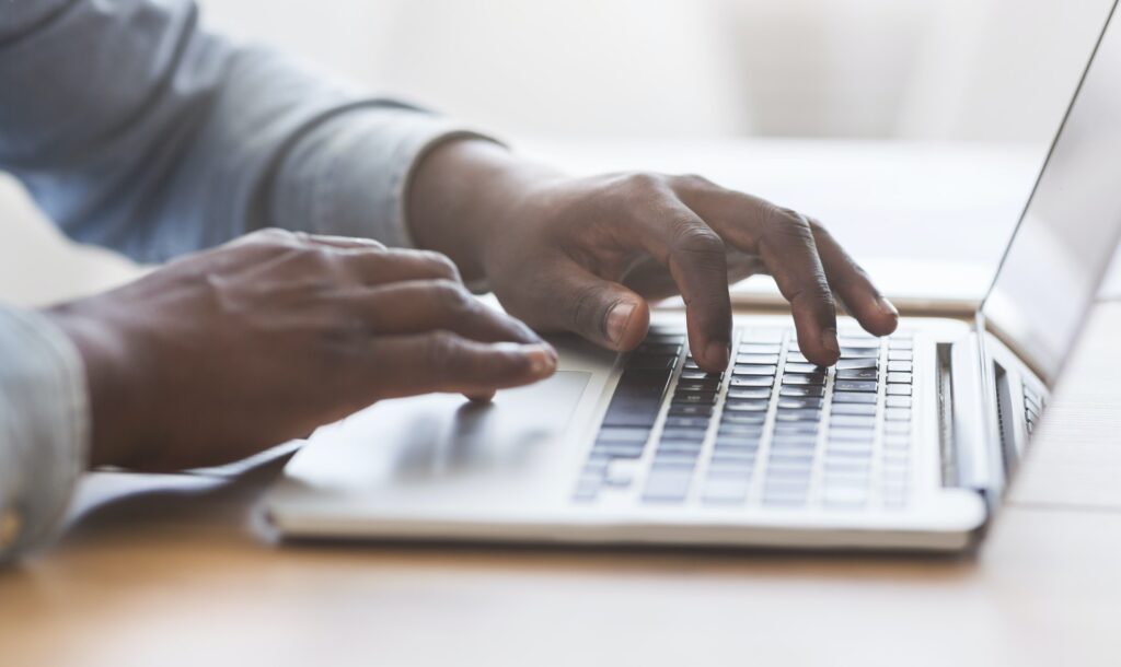 job seeker typing his resume profile