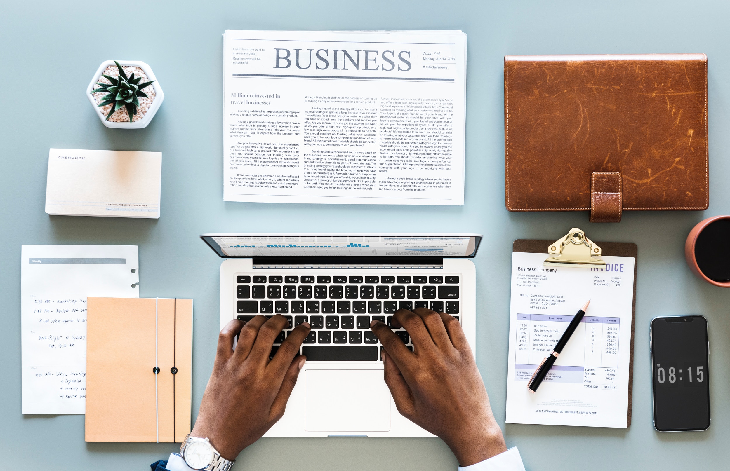 an organized table with laptop and documents