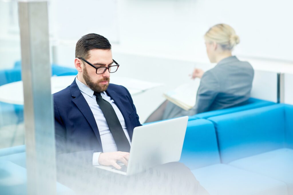 a job seeker checking online resume writing services to hire for his job search