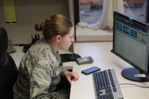 young woman in the office reviewing a military resume